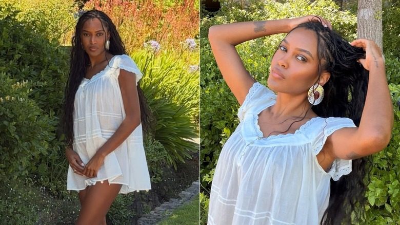 Ciara Miller posant avec de longues tresses dans une robe blanche