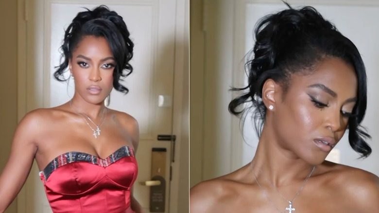 Ciara Miller posant avec des cheveux bouclés dans un chignon glamour