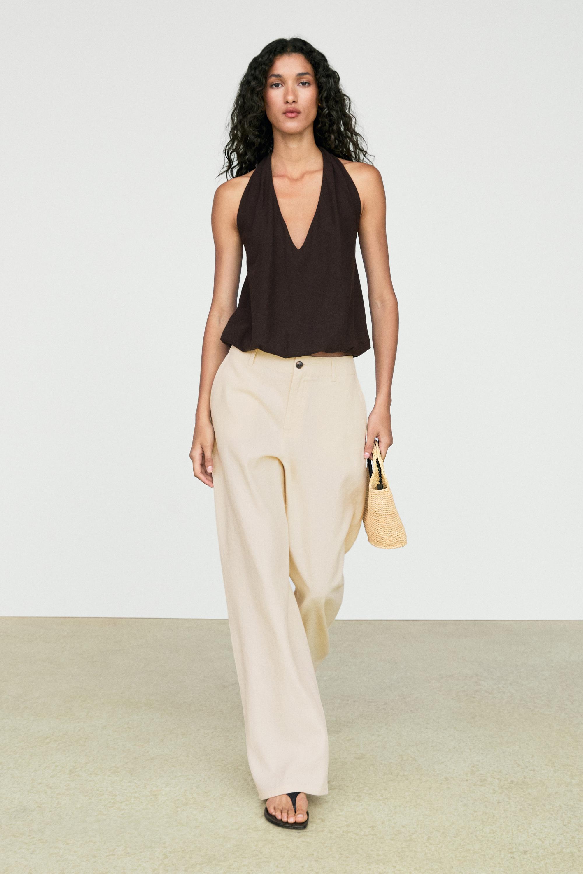 Pantalon en lin de Massimo Dutti, un article phare à acheter en solde.