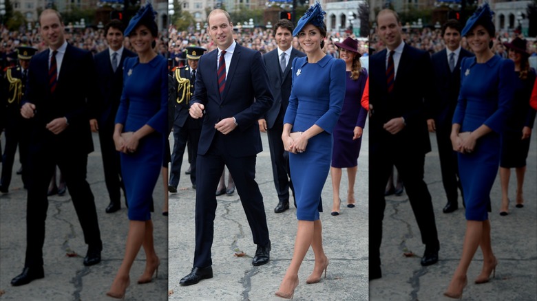 Kate Middleton portant une robe bleu foncé ajustée et un chapeau assorti et le prince William en costume lors d'un événement de bienvenue pour leur tournée royale au Canada en 2016.