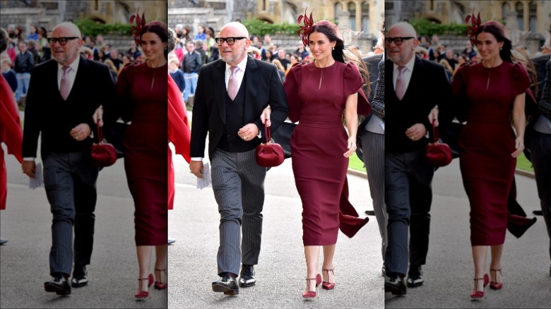 Demi Moore dans une robe violette avec une longue traîne sur le tapis rouge.