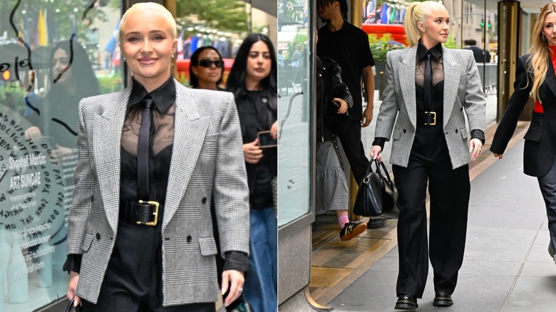 Hayden Panettiere portant un pantalon ample noir avec un haut noir et une chemise noire transparente, avec une ceinture tendance et un blazer gris en septembre 2024.
