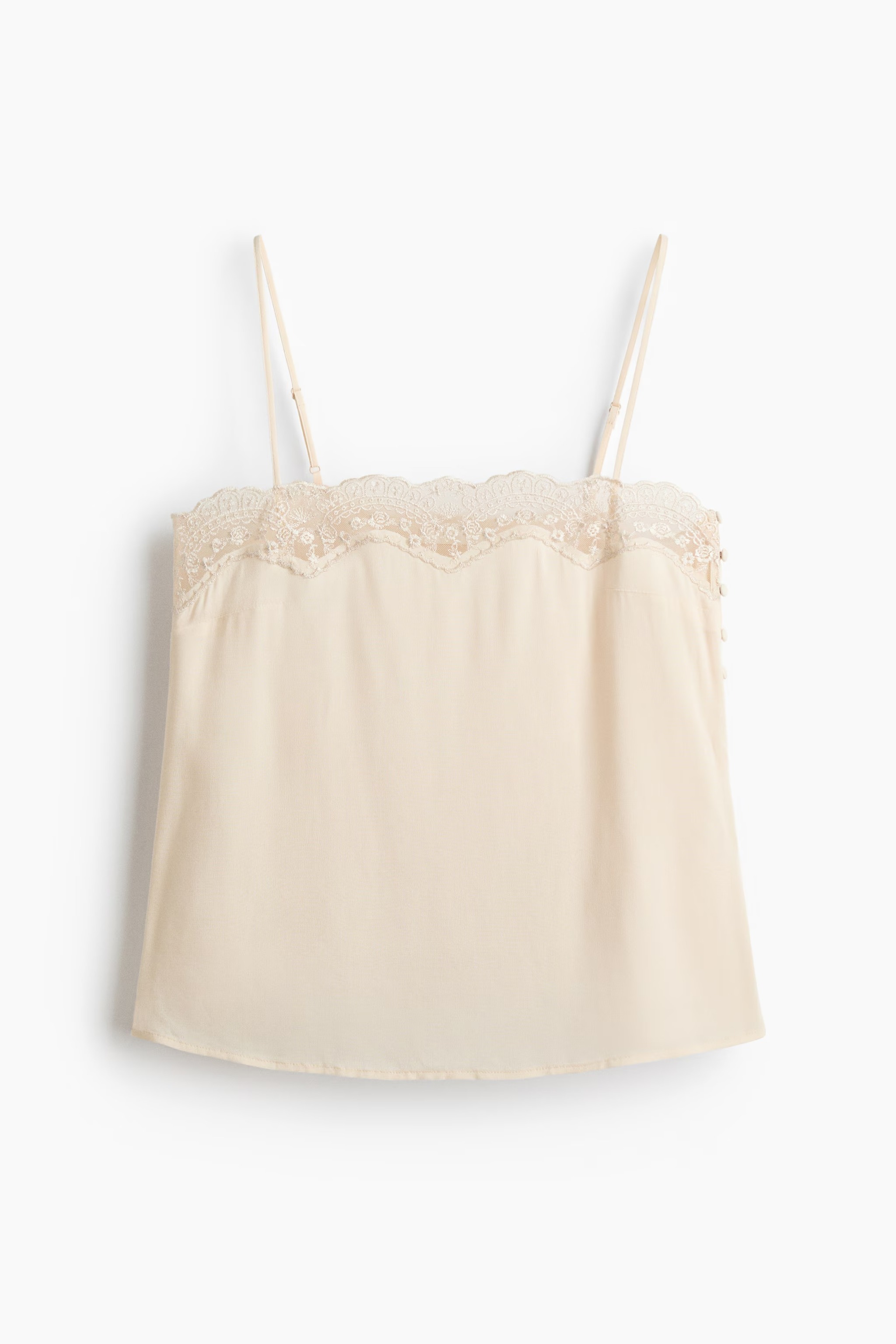 Top écru à encolure droite avec dentelle.